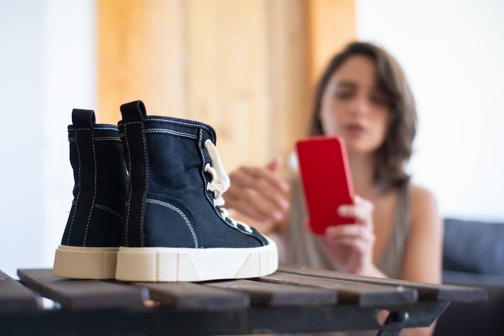 Woman Taking Pictures of Shoes