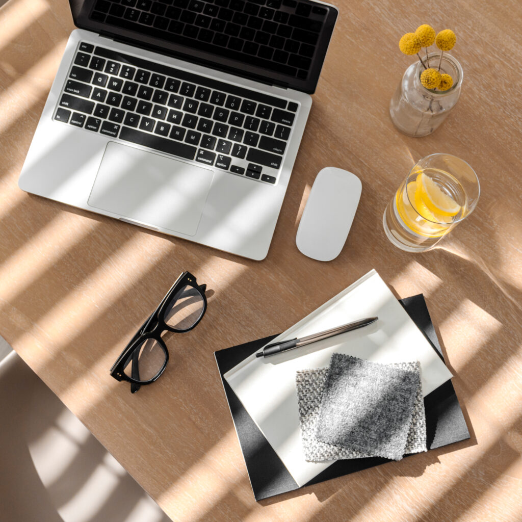Laptop open to Printify dashboard with Etsy logo visible, representing Etsy print on demand setup