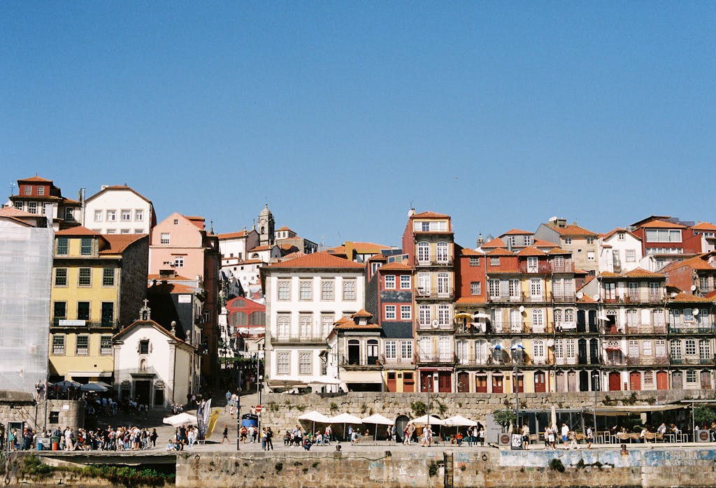 Vibrant historical architecture along the Ribeira waterfront in Porto, Portugal.