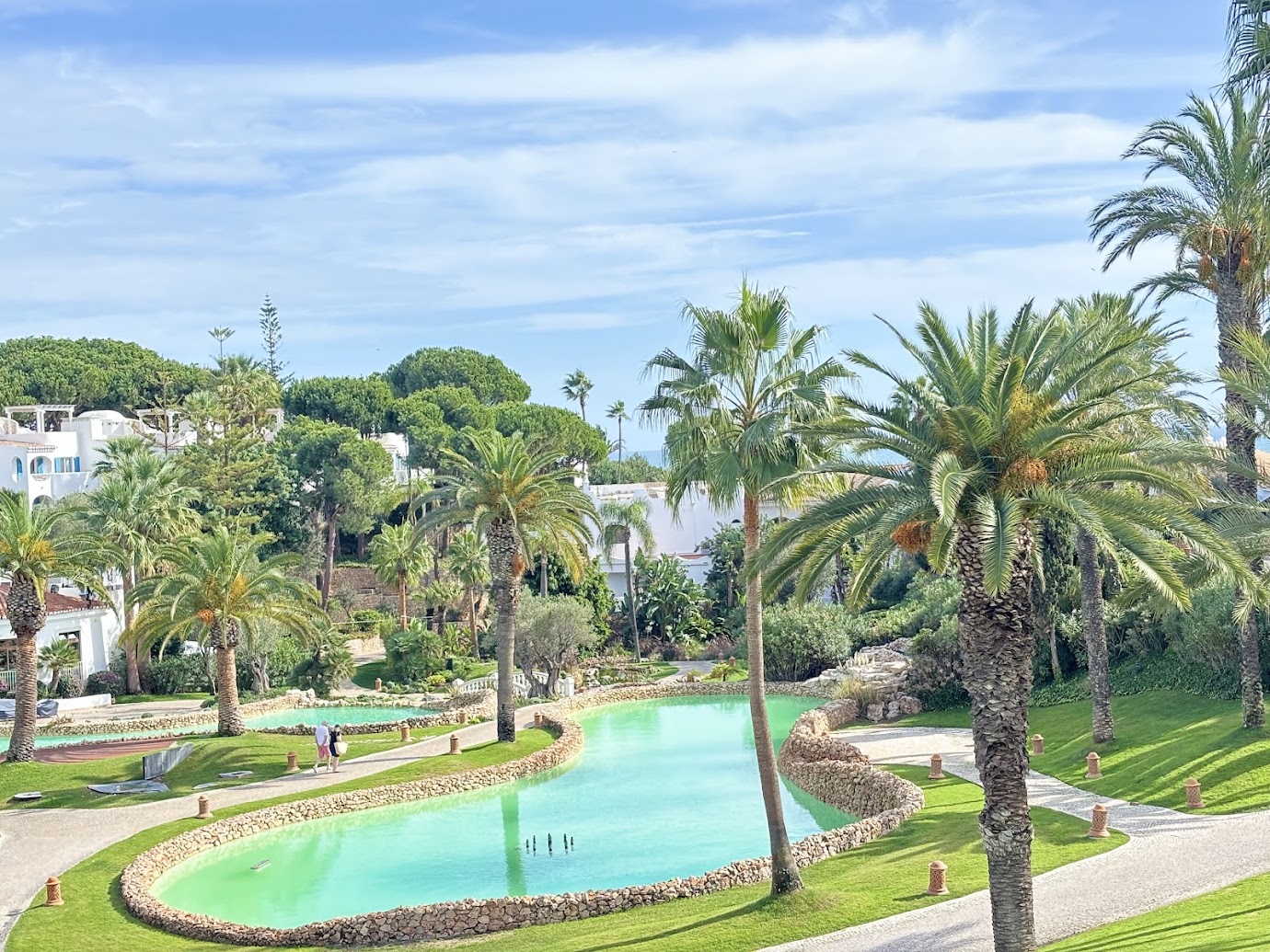 Palm trees and an ornamental water garden at Vila Vita Parc.
